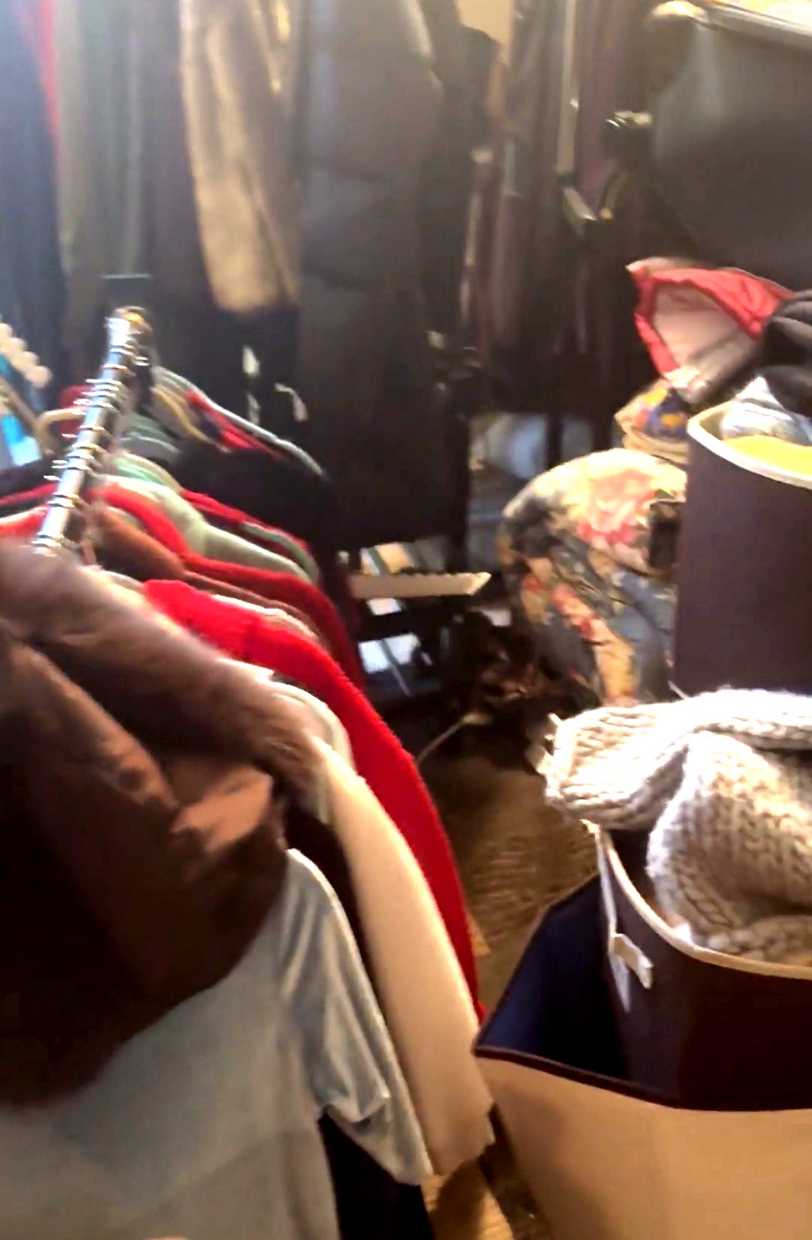 Estate cleanout — packed closet full of clothing being sorted for donation in Charlottesville VA